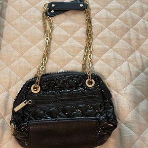 Tory Burch black patent purse with adjustable gold chain crossbody strap